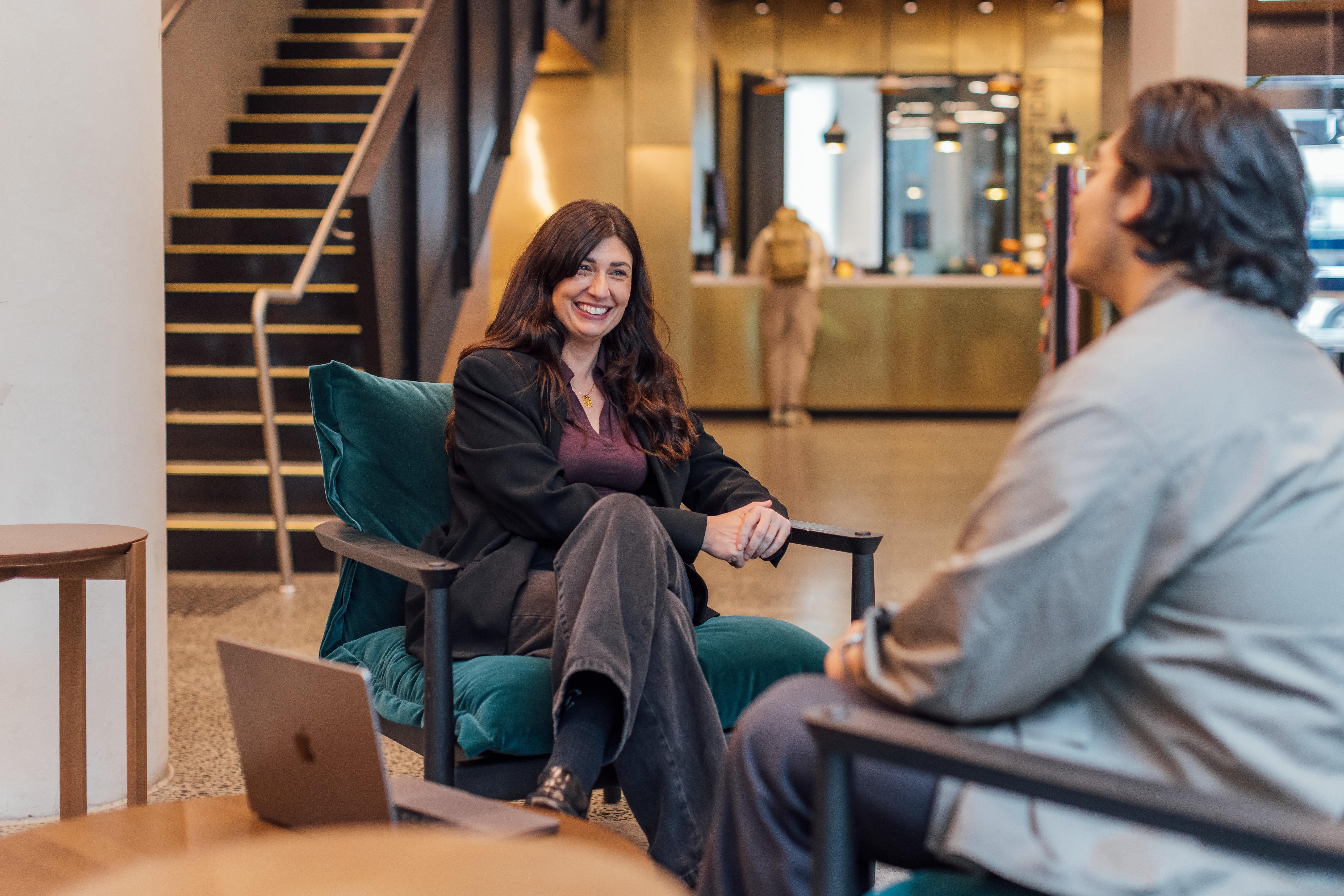 Two people having a conversation in a relaxed setting.