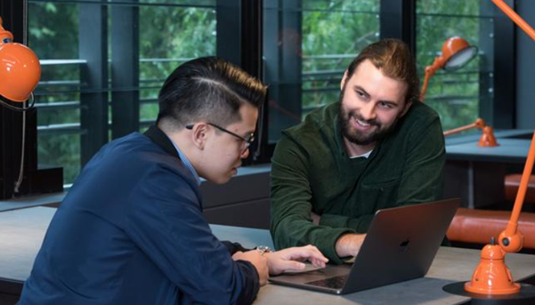 Counsellor working with a teacher to support student wellbeing.