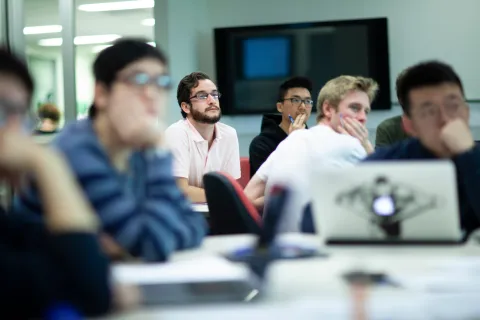 Students in a classroom observing a lecture.